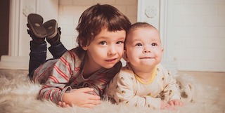 Compete against coworkers or community members in the baby photo contest fundraising idea.
