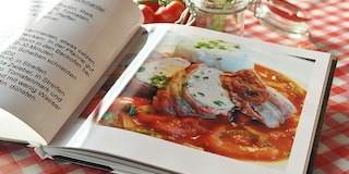 Fundraising ideas for kids like selling cookbooks are fun and easy to accomplish.