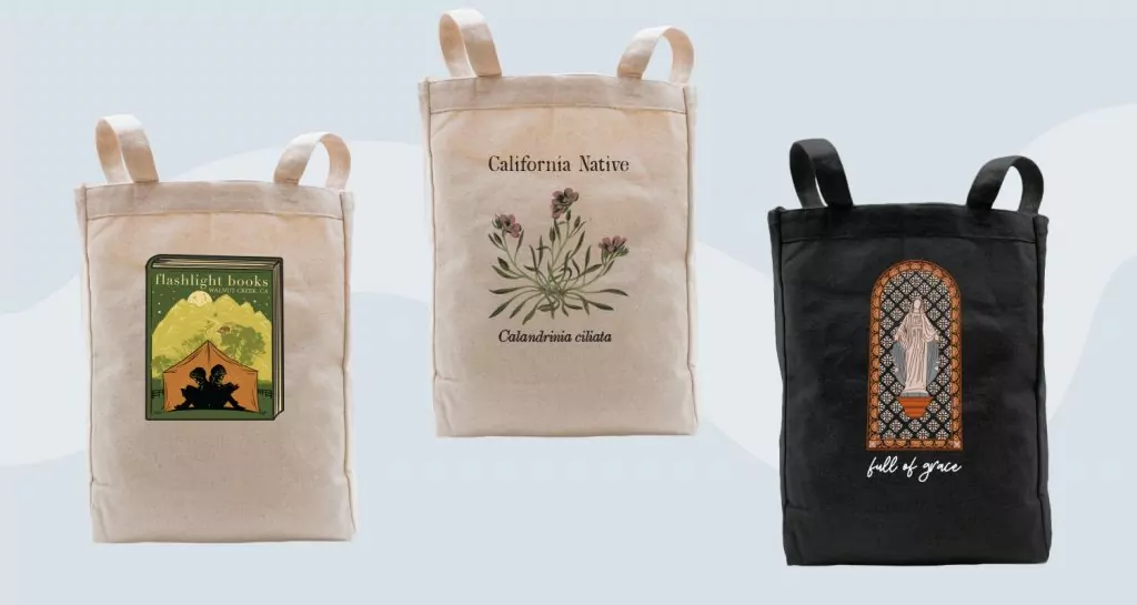 Tote bags with intricate illustrations.