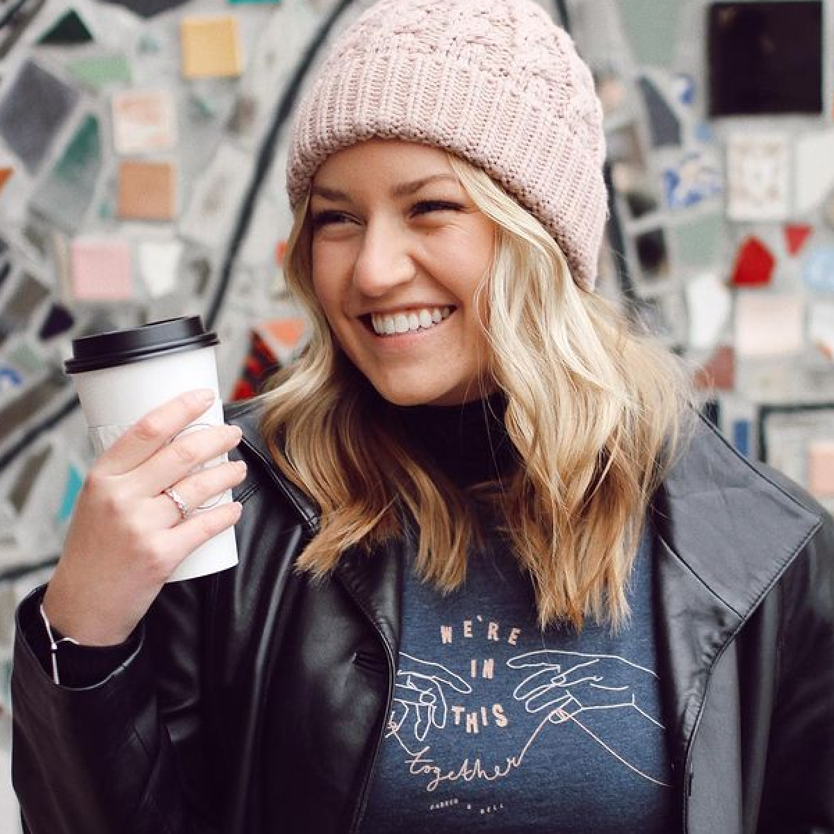 Illustrations of hands is a top t-shirt design trend in 2021.