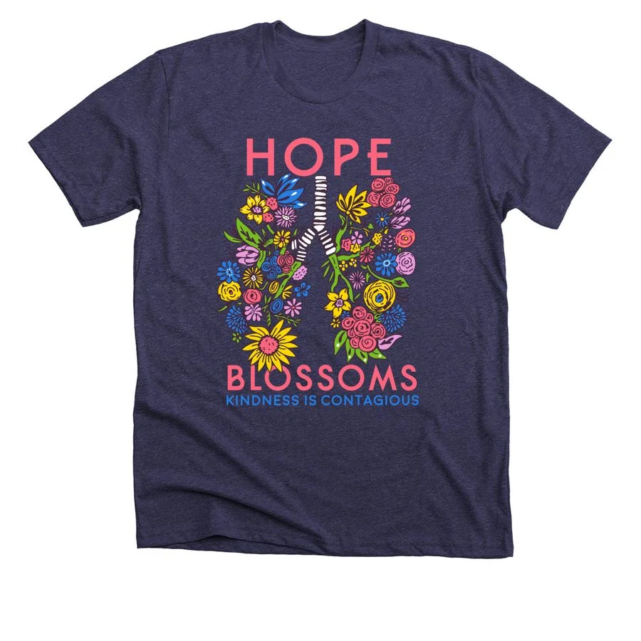 Heather lapis t-shirt featuring 'Hope Blossoms' design with colorful floral bouquet and ribbon graphic