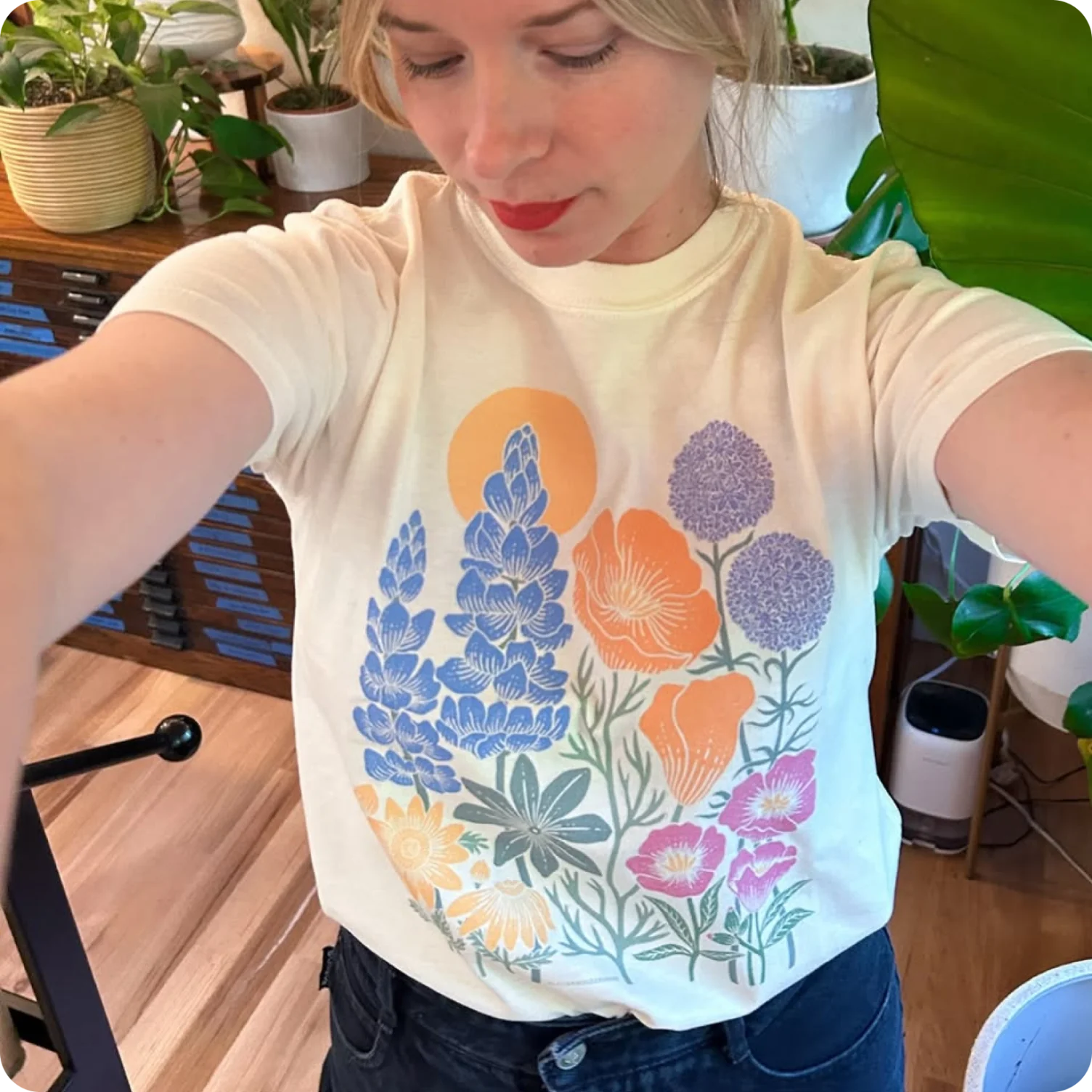 T-shirt featuring colorful botanical illustration inspired by modern folk art florals.
