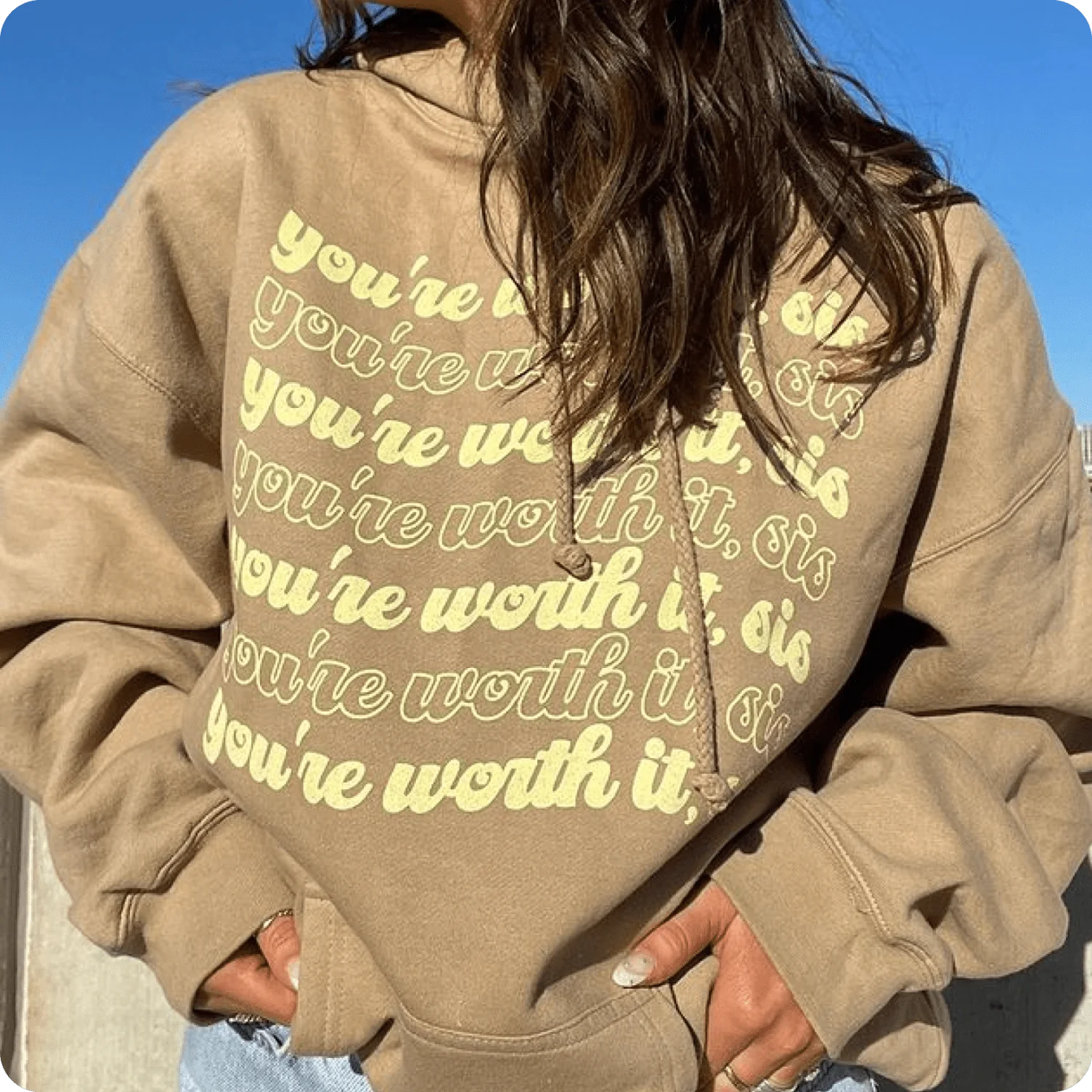 Hoodie featuring a repeating text pattern used as a typographic design element.