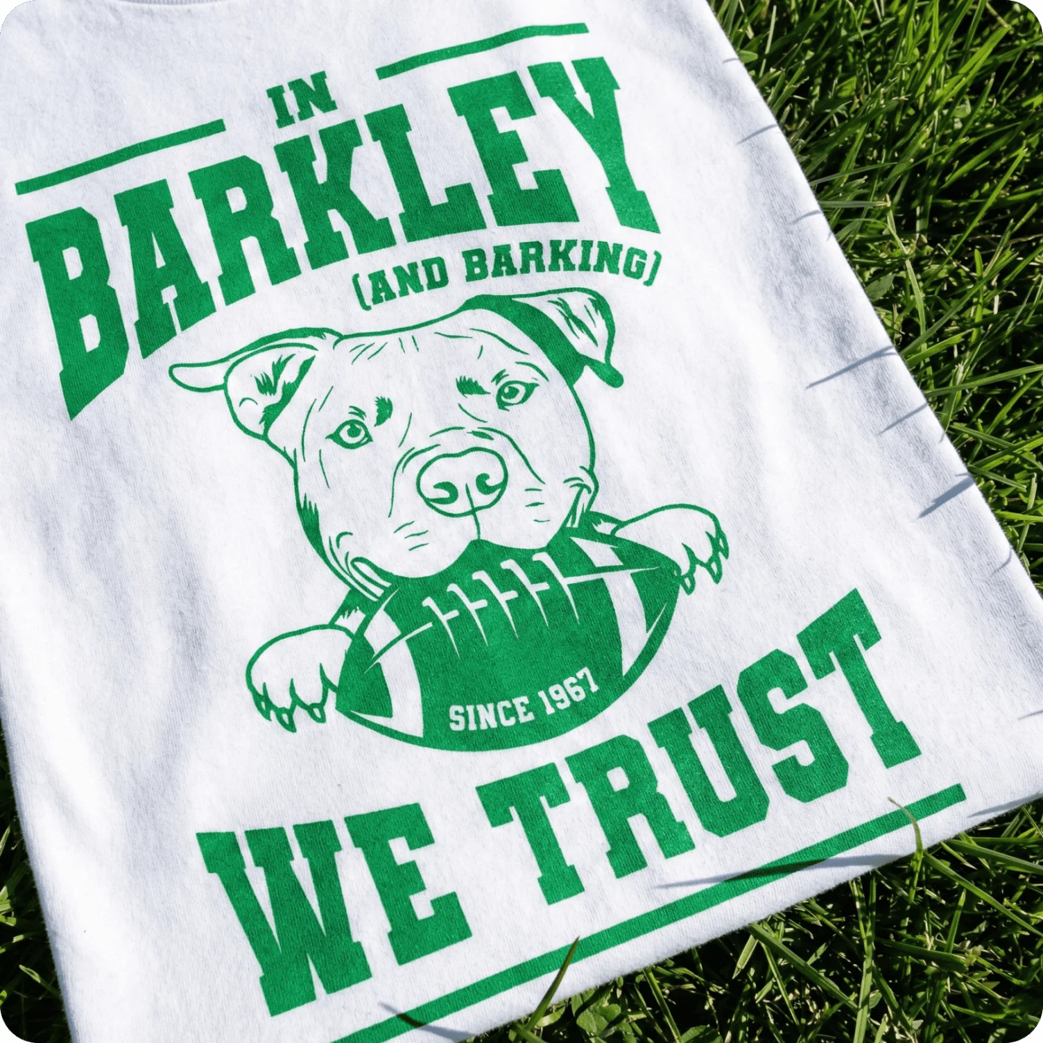 T-shirt featuring varsity-style lettering combined with a playful illustrated sports motif.